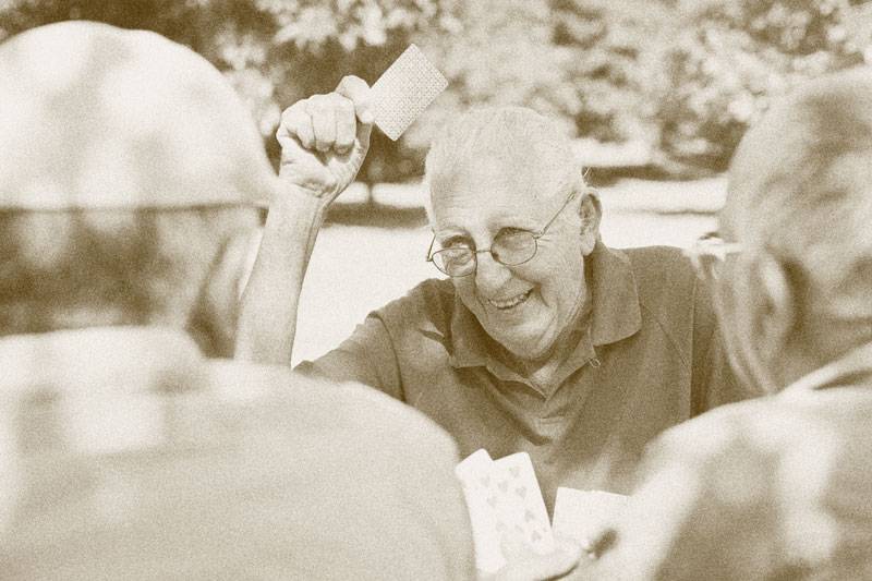 Residents at WLC Management playing card games